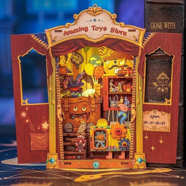 Amazing Toy Store DIY Book Nook Kit, a mini magic shop with toys and enchantment. Features easy 2-hour assembly, touch switch light, PVC dust cover, and more. Perfect for those who love the whimsical world, DIY enthusiasts, book lovers, bookend lovers, model building lovers, dollhouse collectors, bookshelf insert decor.